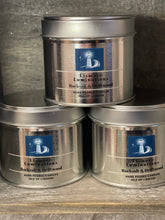 Load image into Gallery viewer, Rock Salt and Driftwood - 8 oz  candle in silver tin.